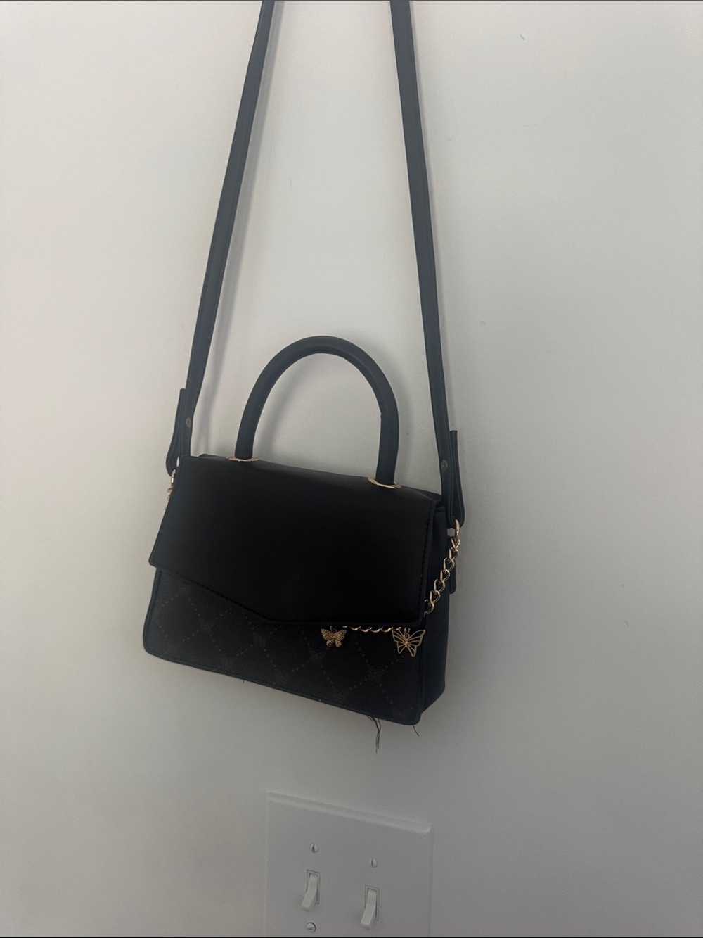 Black Quilted Crossbody Bag with Gold Butterfly Accents